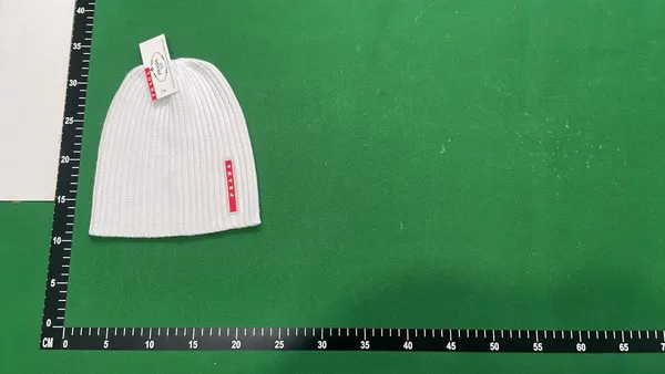 Black Ribbed Knit Beanie With Side Tab — warehouse QC photo 4