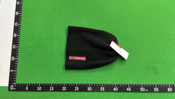 Black Ribbed Knit Beanie With Side Tab (White) — warehouse QC photo 3