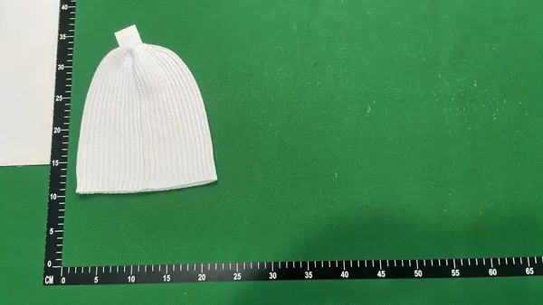 Black Ribbed Knit Beanie With Side Tab (White) — warehouse QC photo 5