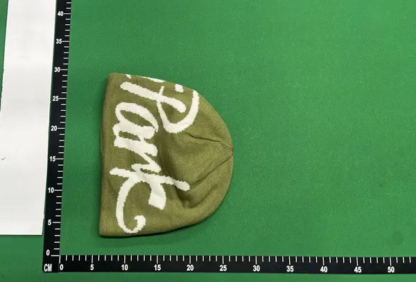 Black Knit Beanie With Script Lettering — warehouse QC photo 6