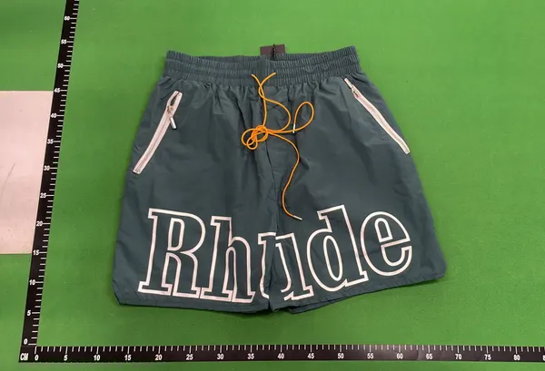 Nylon Shorts With Large Outlined Wordmark Print (Green) — warehouse QC photo 6