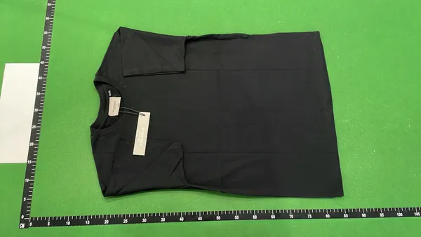 White Relaxed Tee With Small Chest Wordmark — warehouse QC photo 2