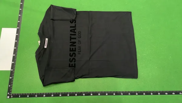White Relaxed Tee With Small Chest Wordmark — warehouse QC photo 3