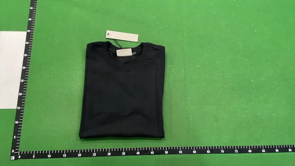 White Relaxed Tee With Small Chest Wordmark — warehouse QC photo 4