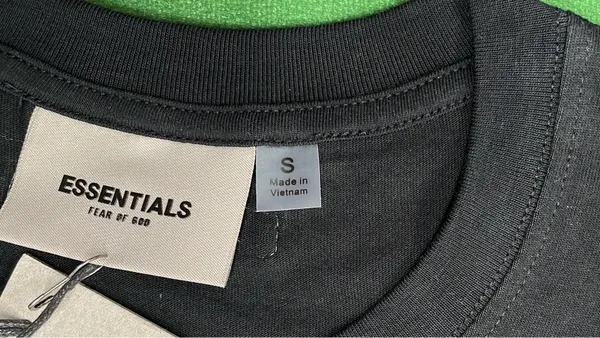 White Relaxed Tee With Small Chest Wordmark — warehouse QC photo 5