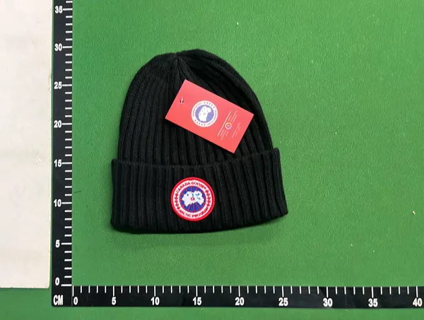 Black Ribbed Knit Beanie With Circular Patch — warehouse QC photo 1