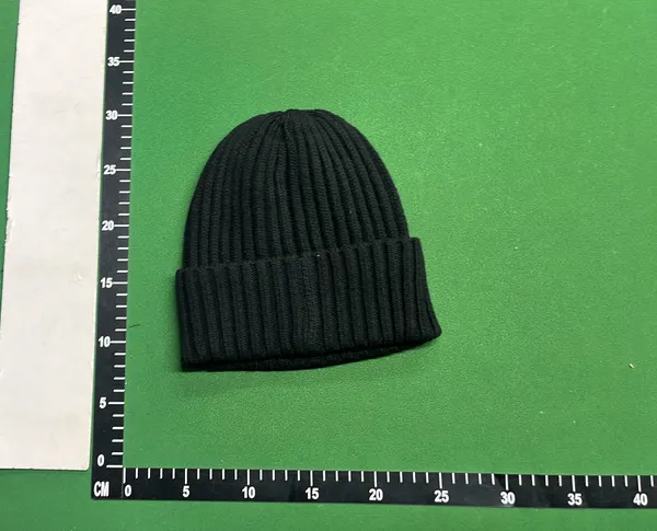Black Ribbed Knit Beanie With Circular Patch — warehouse QC photo 2