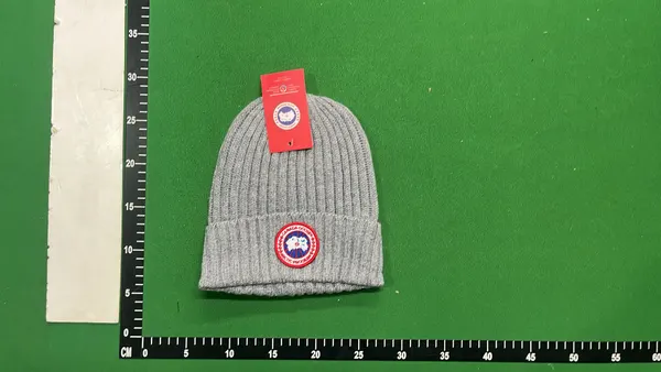 Black Ribbed Knit Beanie With Circular Patch — warehouse QC photo 4