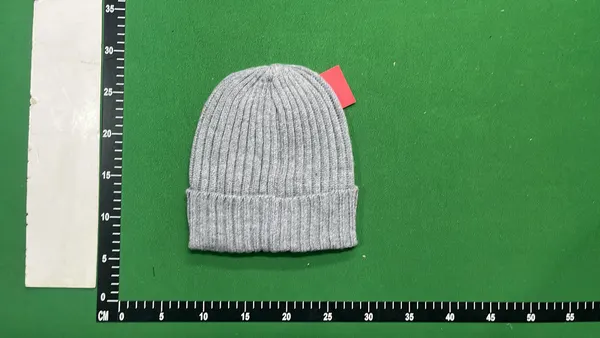 Black Ribbed Knit Beanie With Circular Patch — warehouse QC photo 5