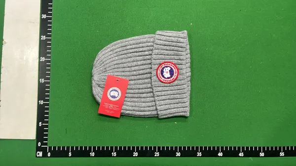 Black Ribbed Knit Beanie With Circular Patch — warehouse QC photo 6