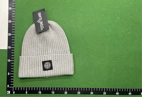 Black Ribbed Beanie With Square Woven Patch — warehouse QC photo 6
