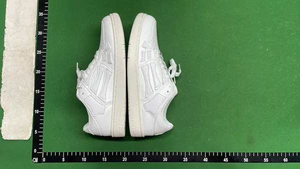 Low-Top Sneakers With Bone-Shaped Side Panels — warehouse QC photo 5