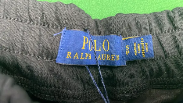 Assorted Embroidered-Emblem Fleece Sweat Shorts — warehouse QC photo 1