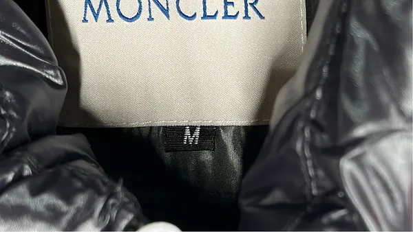 Black Glossy Hooded Puffer Vest — warehouse QC photo 1