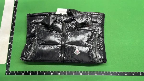 Black Glossy Hooded Puffer Vest — warehouse QC photo 4