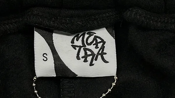 Black Colorblock Pullover Hoodie With Sage Panels — warehouse QC photo 5