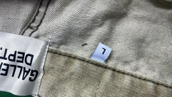 Distressed Flared Jeans With Paint Splatter Print — warehouse QC photo 1