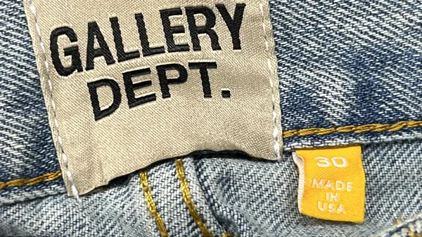 Light Wash Flared Jeans With Contrast Panels — warehouse QC photo 1