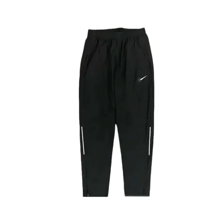 Black Tapered Track Pants With Ankle Zips — merchant catalogue photo