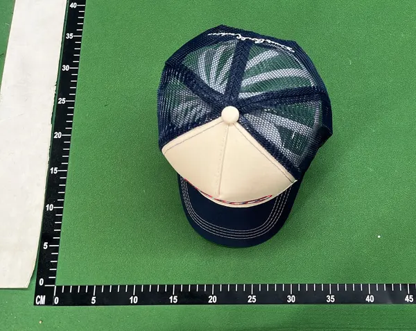 Orange Brim Mesh-Back Trucker Cap — warehouse QC photo 1