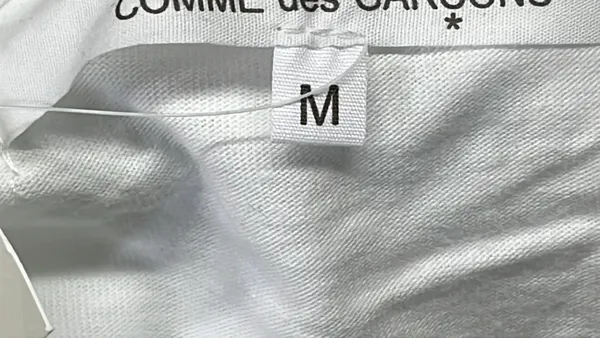 White Long-Sleeve Top With Red Heart Sleeve Print — warehouse QC photo 1