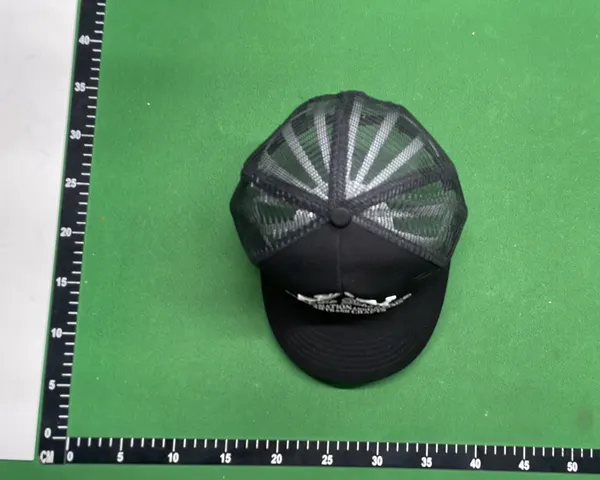 Black Mesh Trucker Cap With Raised Embroidery — warehouse QC photo 1