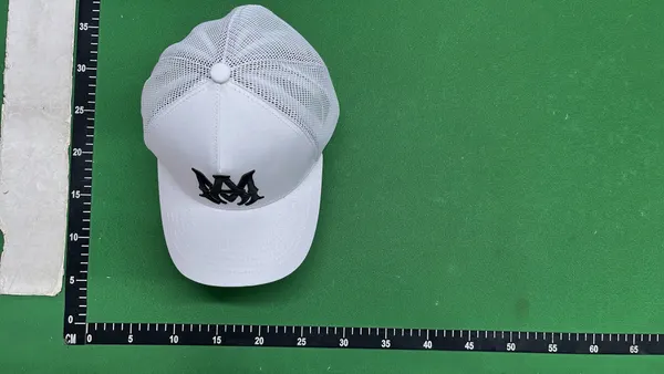 Black Mesh Trucker Cap With Raised Embroidery — warehouse QC photo 4