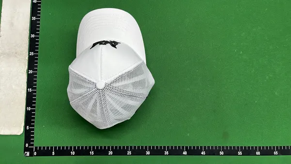 Black Mesh Trucker Cap With Raised Embroidery — warehouse QC photo 5