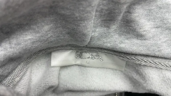 Grey Zip-Up Hoodie With Black Applique Graphic — warehouse QC photo 1