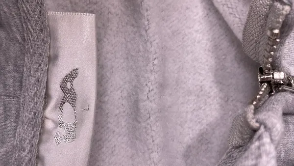 Grey Zip-Up Hoodie With Black Applique Graphic — warehouse QC photo 5